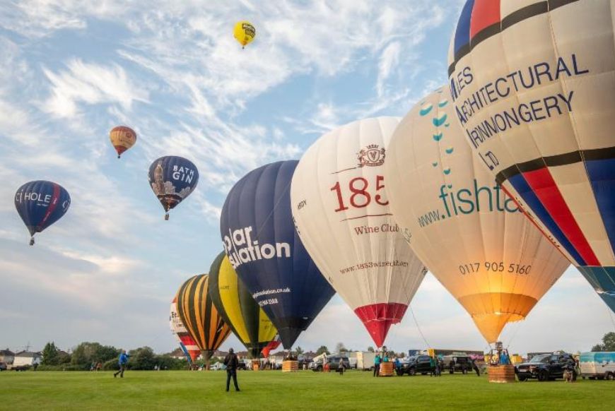 image from the ground of hot air balloons